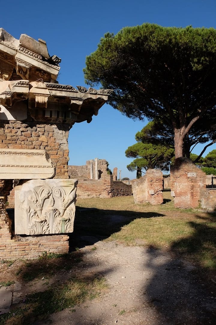 A stone building with a tree in the background
