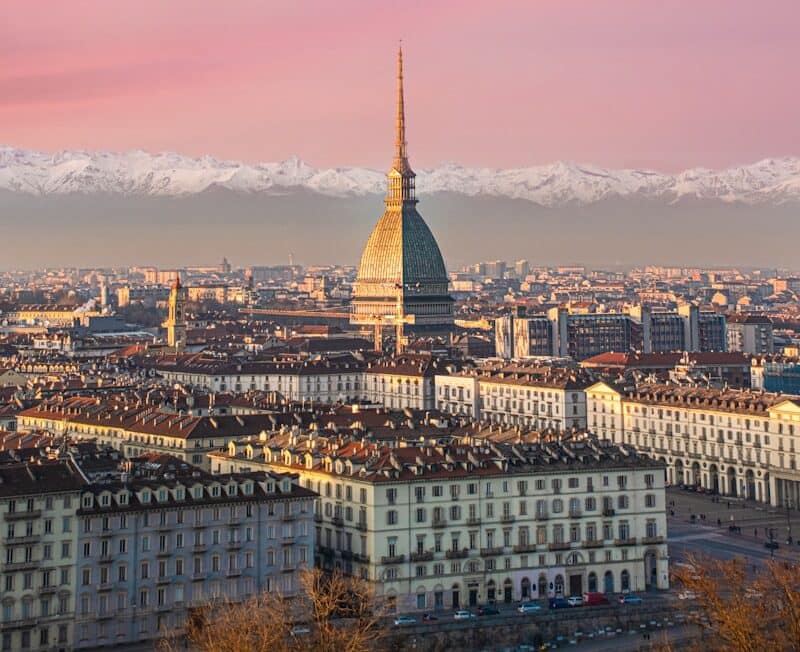 a view of a city with mountains in the background